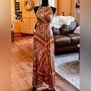 Boho inspired halter dress. Low back, slight hi-low in front. Maxi. Size Small.